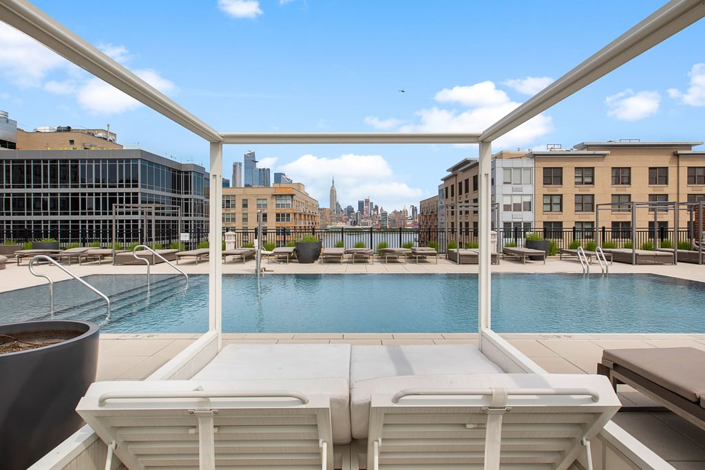 1400 Hudson Street Guide: Uptown Hoboken Waterfront Condos 3 Pool and poolside seating photographed for 1400 Hudson Street in Hoboken