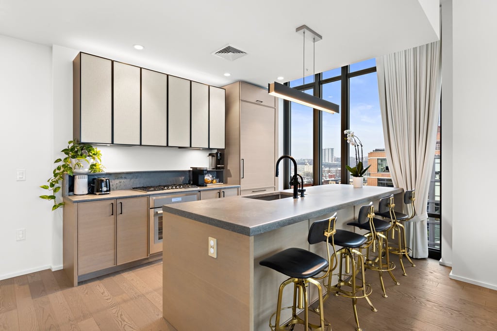 1425 Hudson Street Guide: Toll Brothers Condos at Hudson Tea, Uptown Hoboken 1 Kitchen with island and tall windows in penthouse 5 at 1425 Hudson Street, Hoboken