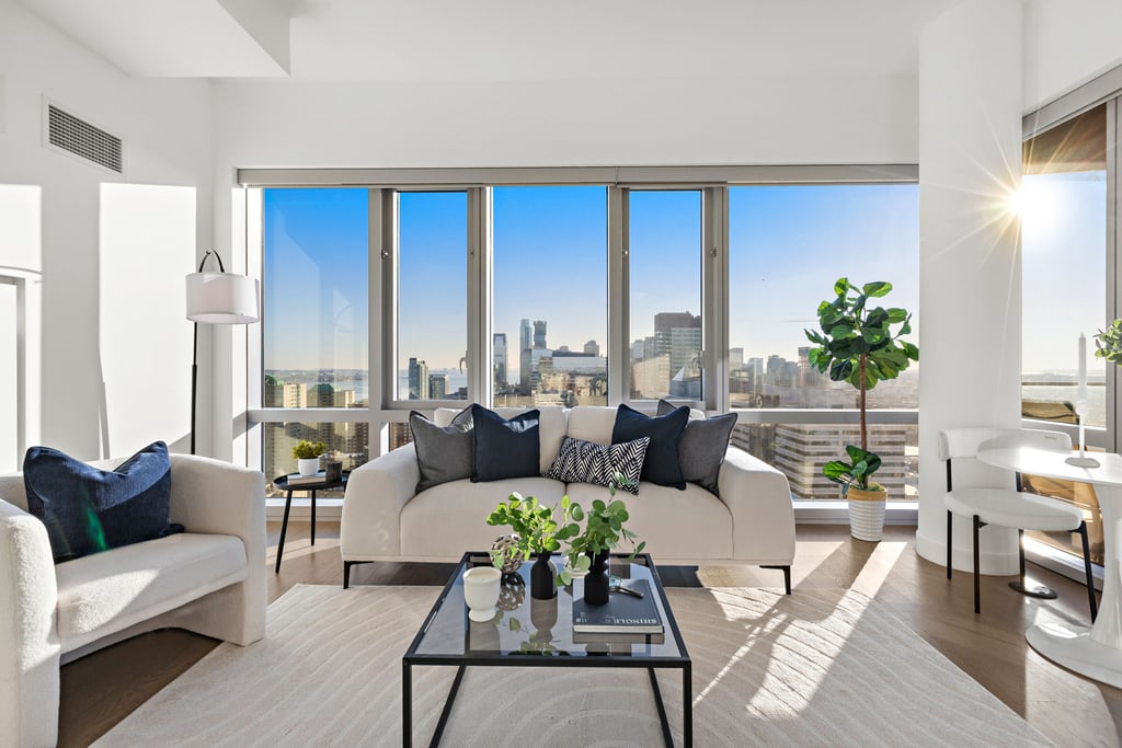 Living room with tall windows in residence 3607 at 75 Park Lane South, Jersey City