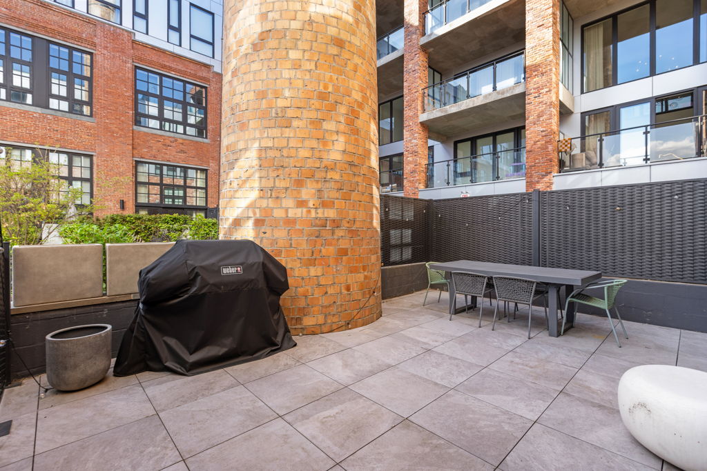Wonder Lofts Guide: 720 Clinton Street, Hoboken 3 Terrace beside the brick smokestack at 720 Clinton Street residence 205 in Hoboken